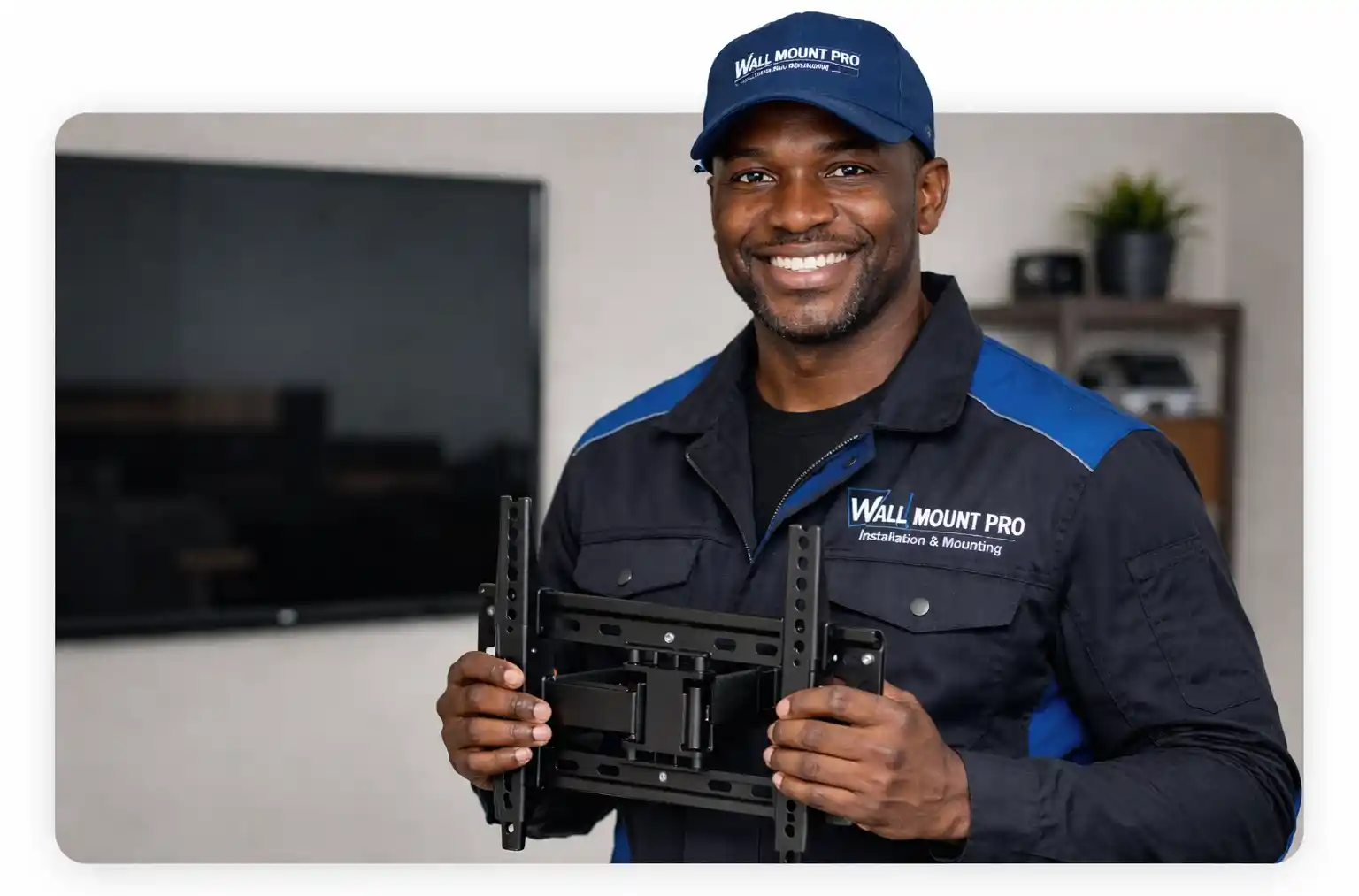 Wall Mount Pro technician holding a TV wall mounting bracket